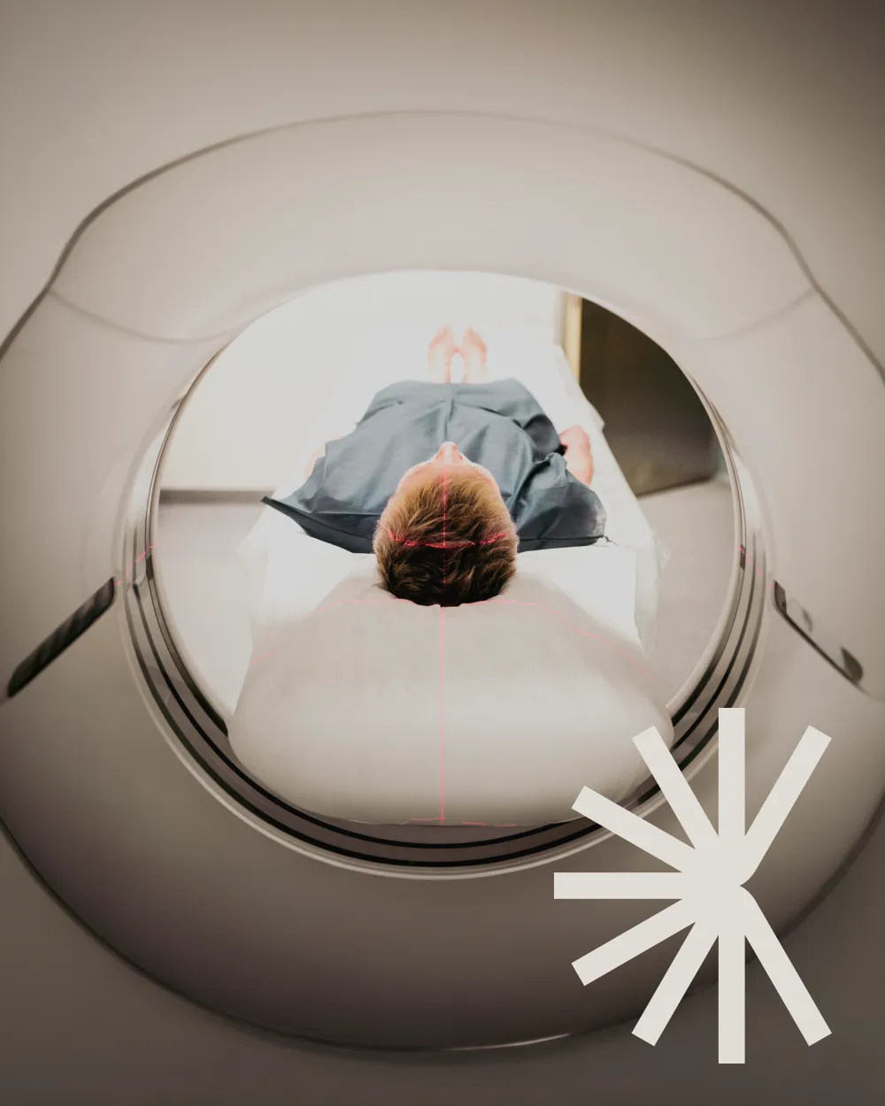 A consultant radiologist examining brain MRI scans with a pencil, marking regions of interest.